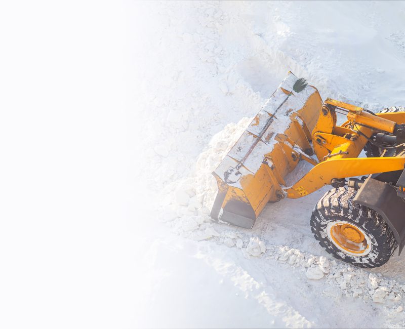 Cleaning and cleaning of roads in the city from snow in winter
